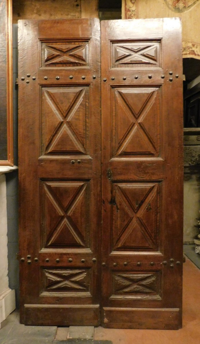 A ptci514 - walnut door with diamond-point carved panels, cm w 125 x h 242 
