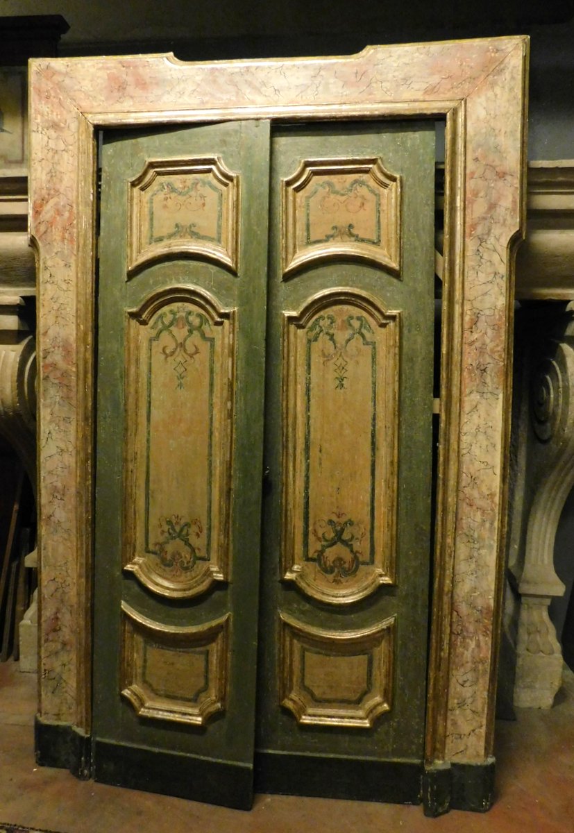 A ptl532 - lacquered and gilded door with painted panels, cm l 155 x h 230